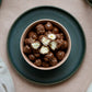 100g pouch of milk chocolate covered caramel popcorn, made in Melbourne, Australia