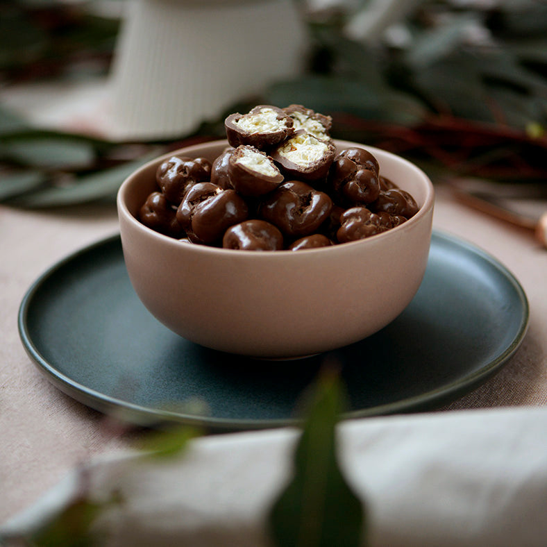 100g pouch of milk chocolate covered caramel popcorn, made in Melbourne, Australia