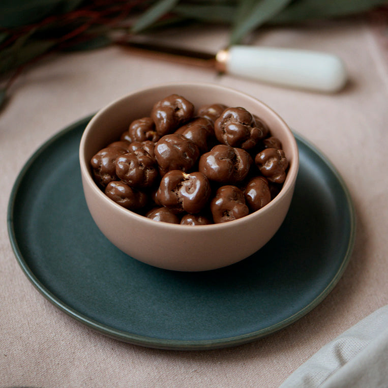 100g pouch of milk chocolate covered caramel popcorn, made in Melbourne, Australia