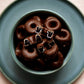 120g bag of dark chocolate coated aniseed rings, made in Melbourne, Australia