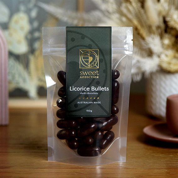 150g bag of dark chocolate coated licorice bullets, made in Melbourne, Australia