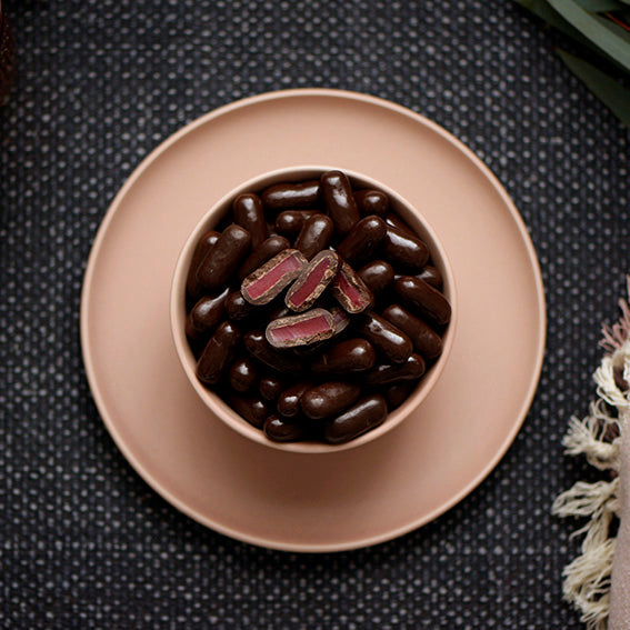 150g bag of dark chocolate coated raspberry bullets, made in Melbourne, Australia