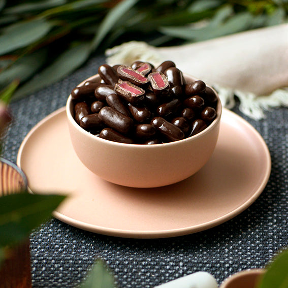 150g bag of dark chocolate coated raspberry bullets, made in Melbourne, Australia