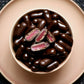 150g bag of dark chocolate coated raspberry bullets, made in Melbourne, Australia