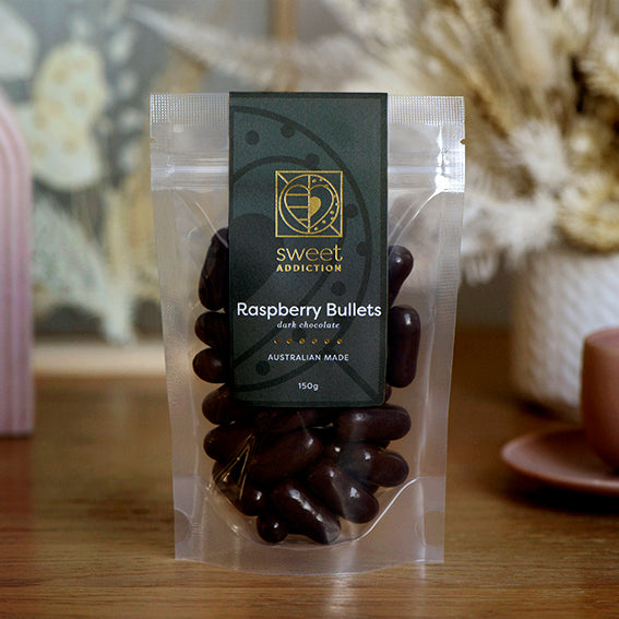150g bag of dark chocolate coated raspberry bullets, made in Melbourne, Australia