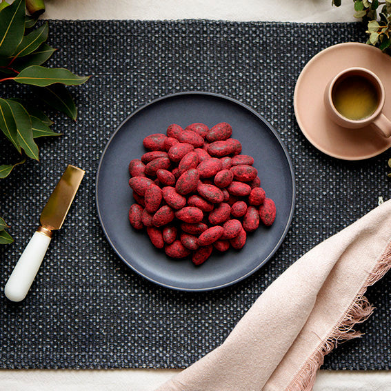 120g bag of raspberry dusted dark chocolate coated almonds, made in Melbourne, Australia
