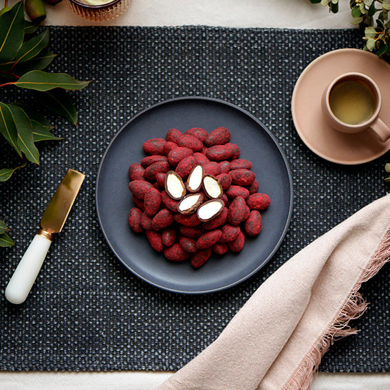 120g bag of raspberry dusted dark chocolate coated almonds, made in Melbourne, Australia