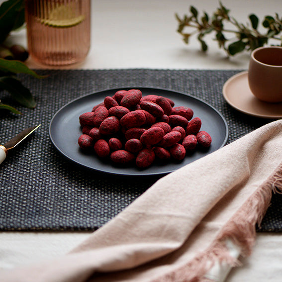 120g bag of raspberry dusted dark chocolate coated almonds, made in Melbourne, Australia