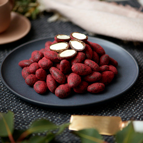 120g bag of raspberry dusted dark chocolate coated almonds, made in Melbourne, Australia