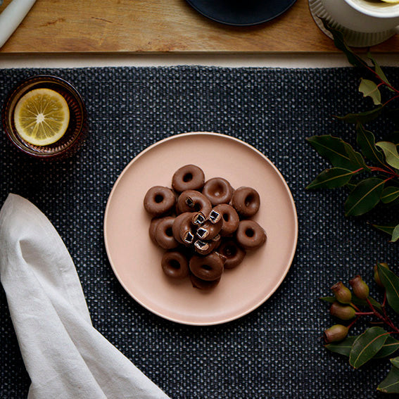 120g bag of milk chocolate coated aniseed rings, made in Melbourne, Australia