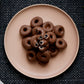 120g bag of milk chocolate coated aniseed rings, made in Melbourne, Australia