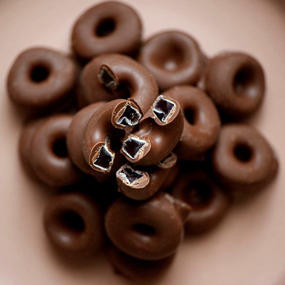 120g bag of milk chocolate coated aniseed rings, made in Melbourne, Australia