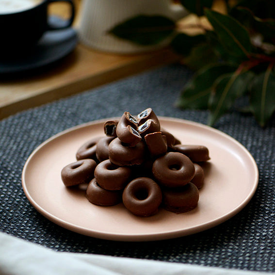 120g bag of milk chocolate coated aniseed rings, made in Melbourne, Australia