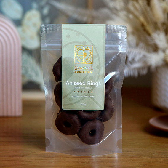 120g bag of milk chocolate coated aniseed rings, made in Melbourne, Australia