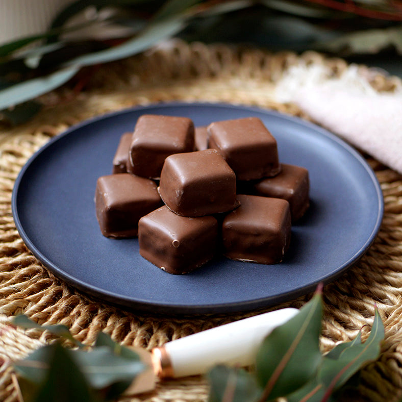 90g bag of gluten free milk chocolate coated honeycomb, made in Melbourne, Australia