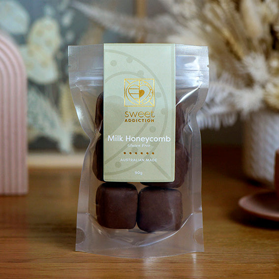 90g bag of gluten free milk chocolate coated honeycomb, made in Melbourne, Australia