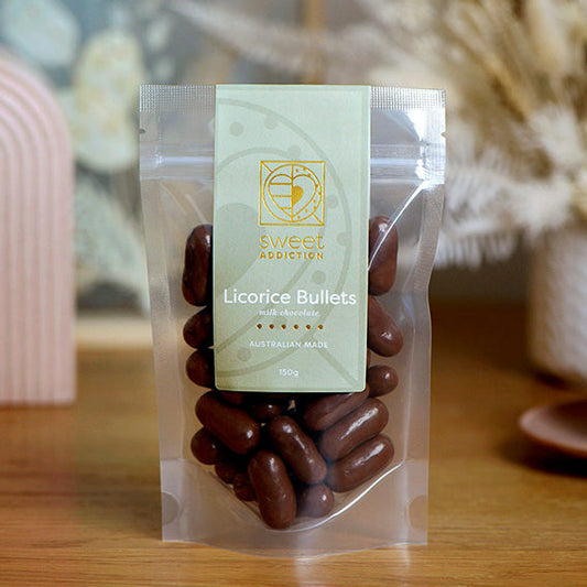 150g bag of milk chocolate coated licorice bullets, made in Melbourne, Australia