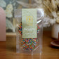 120g pack of milk chocolate discs covered in hundreds and thousands, made in Melbourne, Australia