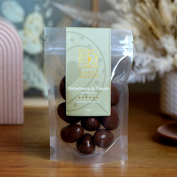 150g bag of milk chocolate coated strawberry and cream lollies, made in Melbourne, Australia