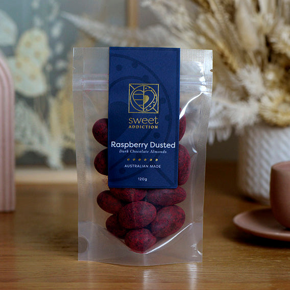 120g bag of raspberry dusted dark chocolate coated almonds, made in Melbourne, Australia