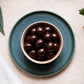 130g bag of vegan dark chocolate coated macadamias, made in Melbourne, Australia