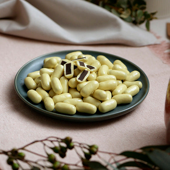 150g bag of white chocolate coated licorice bullets, made in Melbourne, Australia